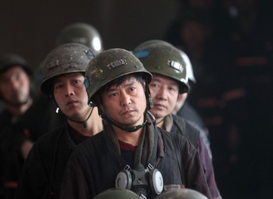 File photos of mine rescue workers in Henan Province