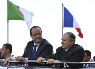 French President Francois Hollande, left, and Algerian President Abdelaziz Bouteflika