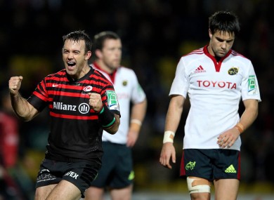 Neil de Kock celebrates as Munster's Conor Murray leaves the pitch at Vicarage Road.