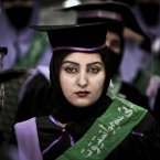 An Afghan midwife attends her graduation ceremony at the governor's house, in Jalalabad east of Kabul, Afghanistan, Wednesday, Jan. 16, 2013. Over 52, midwives graduated after receiving 2 year of training in Jalalabad. (AP Photo/Rahmat Gul)