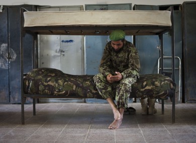 File photo of an Afghan National Army soldier n his bed inside the sleeping quarters of his barracks in Kunduz.