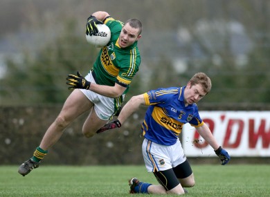Kerry's Patrick Curtain beats Brian Fox to the ball.