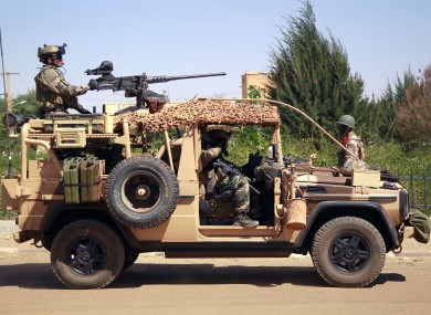French special forces drive through the city of Gao, Northern Mali, yesterday.