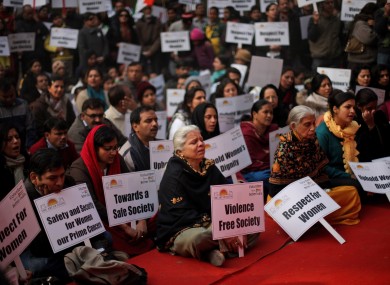 Indians sing devotional songs during a gathering to mourn the death of a 23-year old rape victim in New Delhi, India