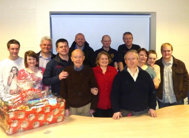 Jack Healy, centre, with family and members of the APFS crew who helped save him in Dublin Airport.