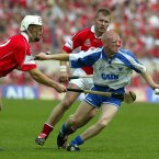 Mullane, tackled here by Cork's Timmy McCarthy and Diarmuid O'Sullivan, fires 3-1 from play but Waterford fall to defeat in Thurles.