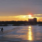 Skaters at a frozen canal as the sun sets near Durgerdam, north of Amsterdam, Netherlands. (AP Photo/Margriet Faber)