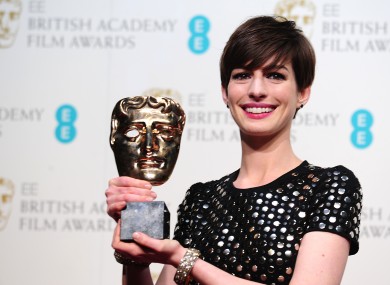 Anne Hathaway, not holding Eddie Redmayne's hair back