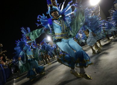 Performers from the Unidos de Vila Isabel samba school parade during Carnival celebrations at the Sambadrome in Rio de Janeiro