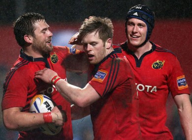 Munster's CJ Sander celebrates his try with Ivan Dineen and Ian Nagle.