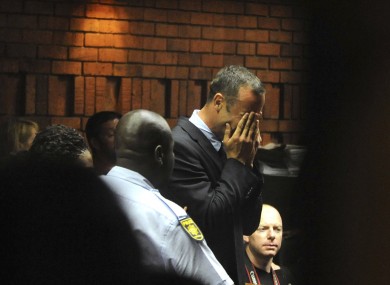 Athlete Oscar Pistorius weeps in court in Pretoria, South Africa, yesterday.