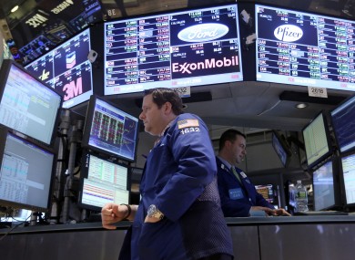 Traders work on the floor of the New York Stock Exchange.