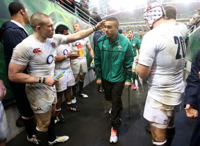 Mike Brown of England console's Ireland's Simon Zebo.