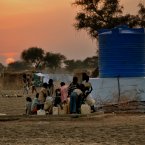 Oxfam is providing the camp with clean, safe water. The soil in the camp itself means that drilling boreholes has been problematic so far â so most of the water is trucked in from boreholes a few miles away, and emptied into these tanks for people to collect from.