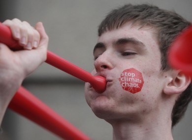 A member of protest group Stop Climate Chaos outside Leinster House in late 2011.